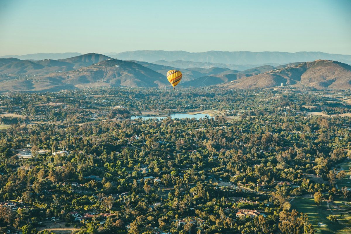 Hot air balloon over the green hills of Rancho Santa Fe